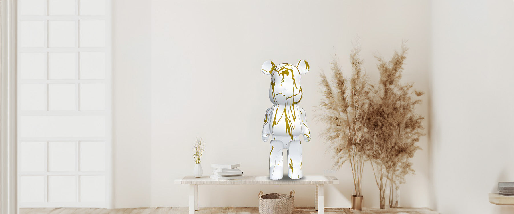 white and gold giant bear sculpture in a neutral background 