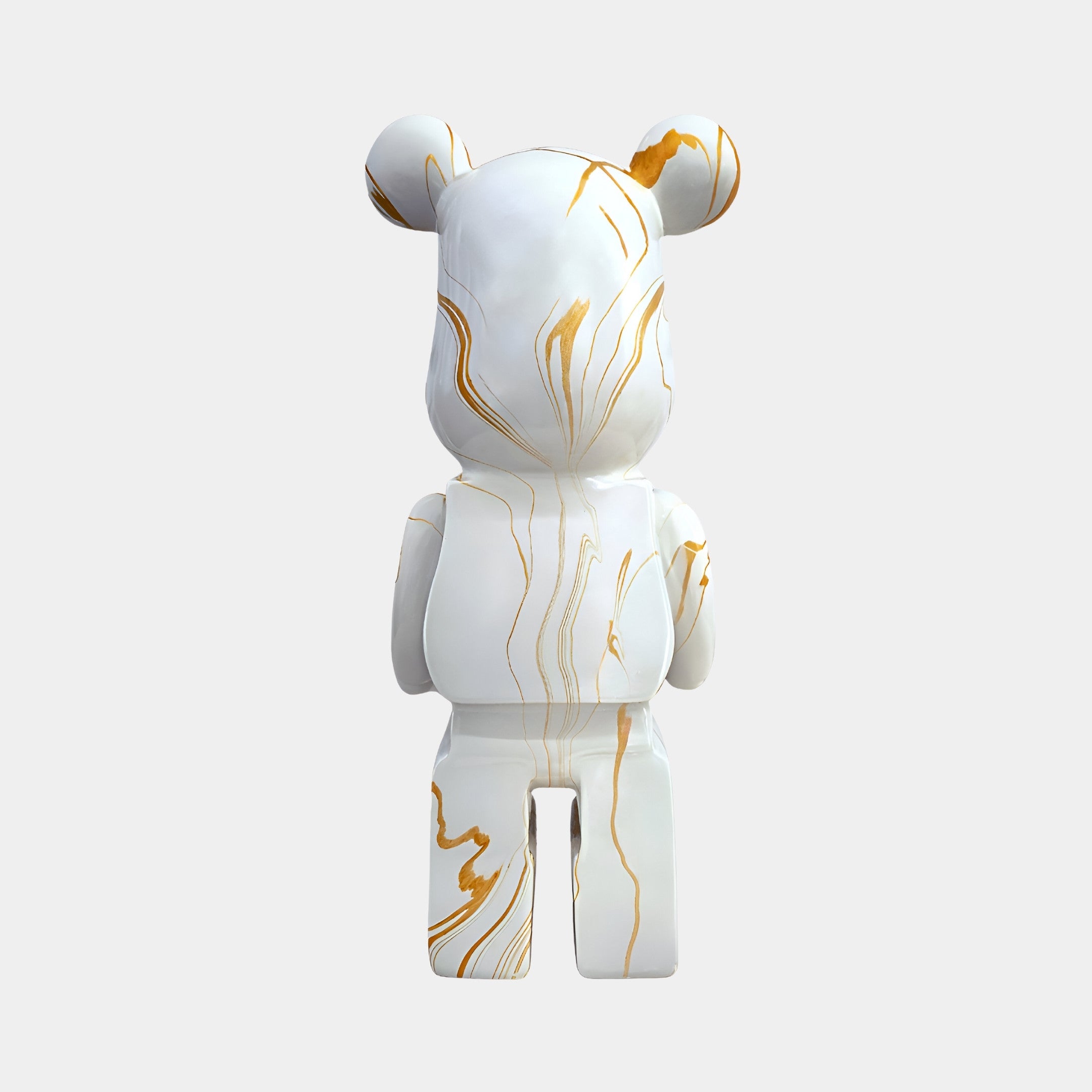 Rear view of the 50cm Golden Luster bear sculpture featuring cascading gold drips on white.