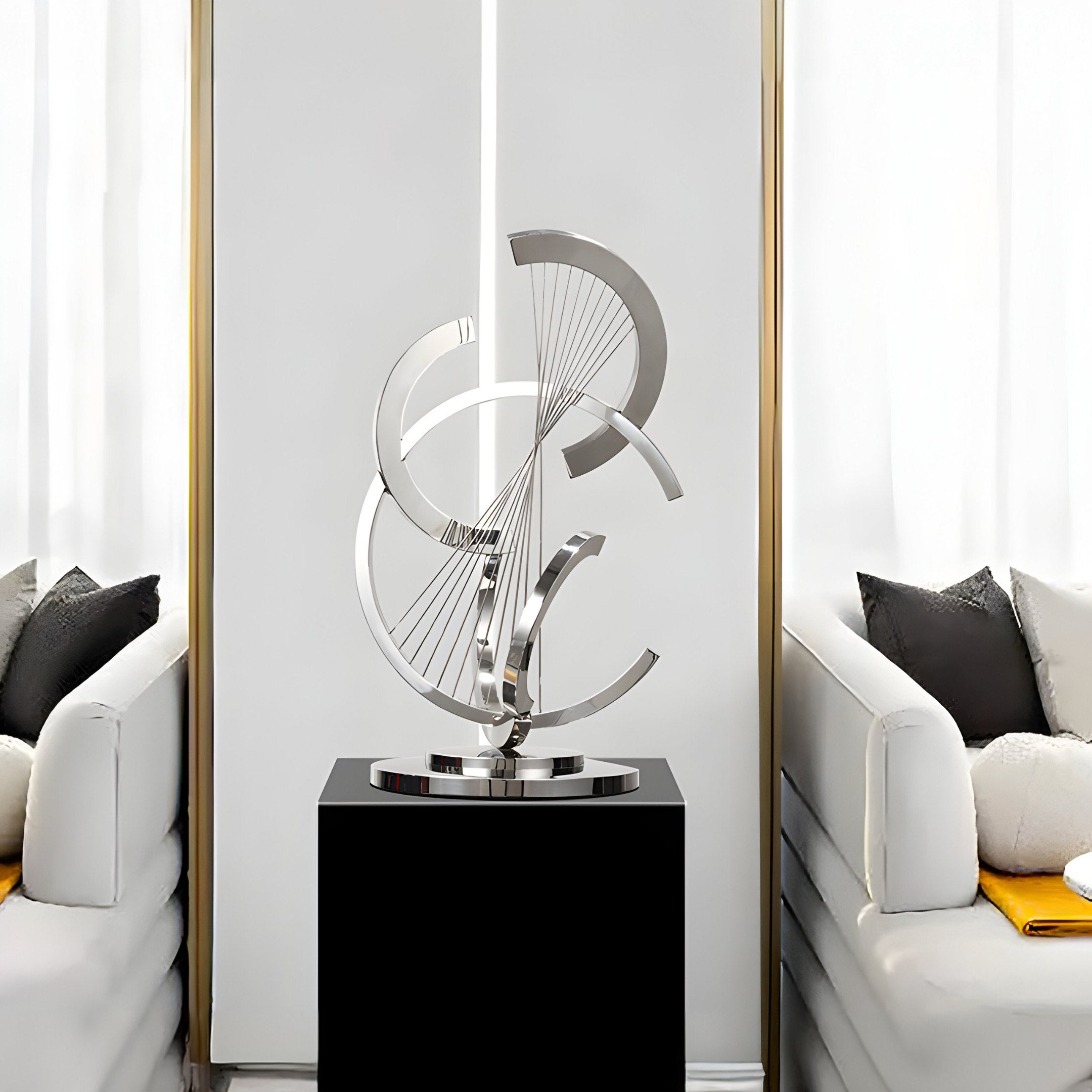 The sleek stainless steel sculpture stands elegantly on a pedestal, adding a contemporary touch to the minimalist living room setting.